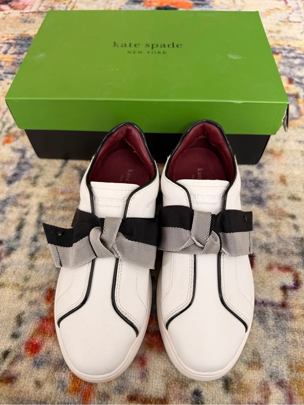 kate spade White Leather Slip-On Sneakers with Black & Gray Bow Trim